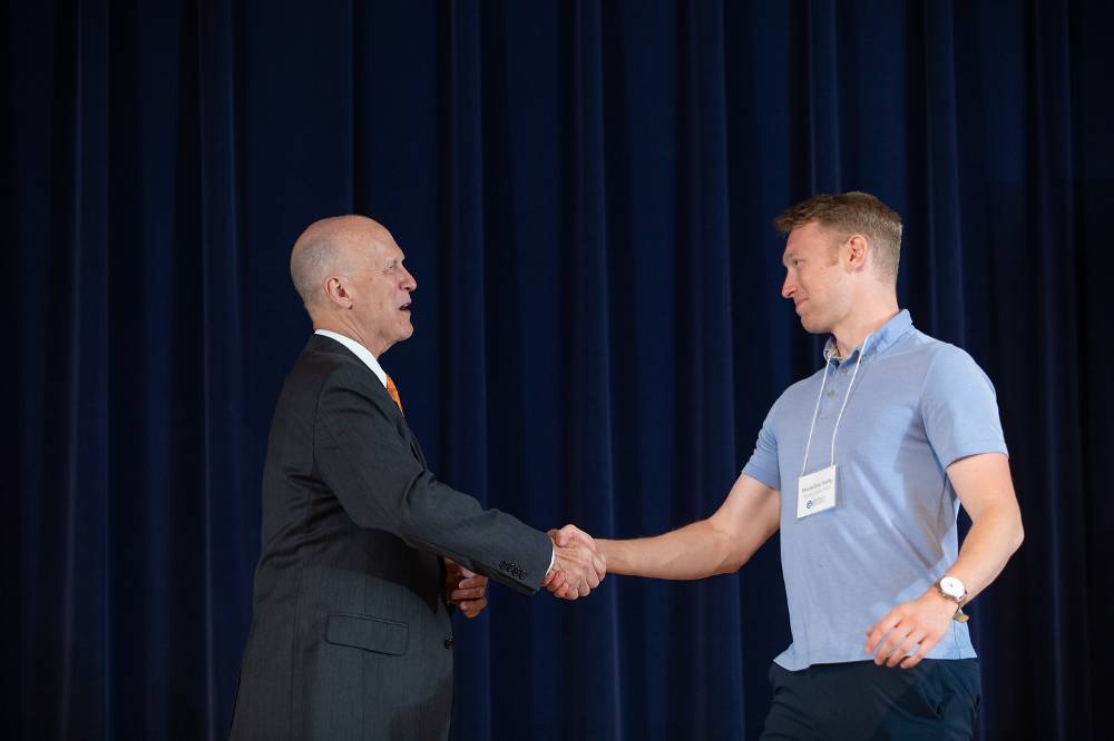 Maximillian Young shaking hands with Dr. Potteiger.